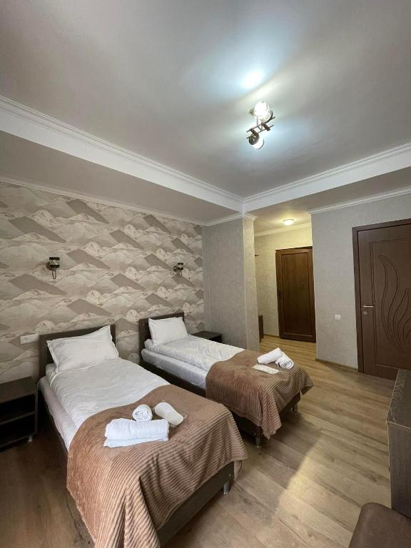 Postel nebo postele na pokoji v ubytování Hotel Shina
