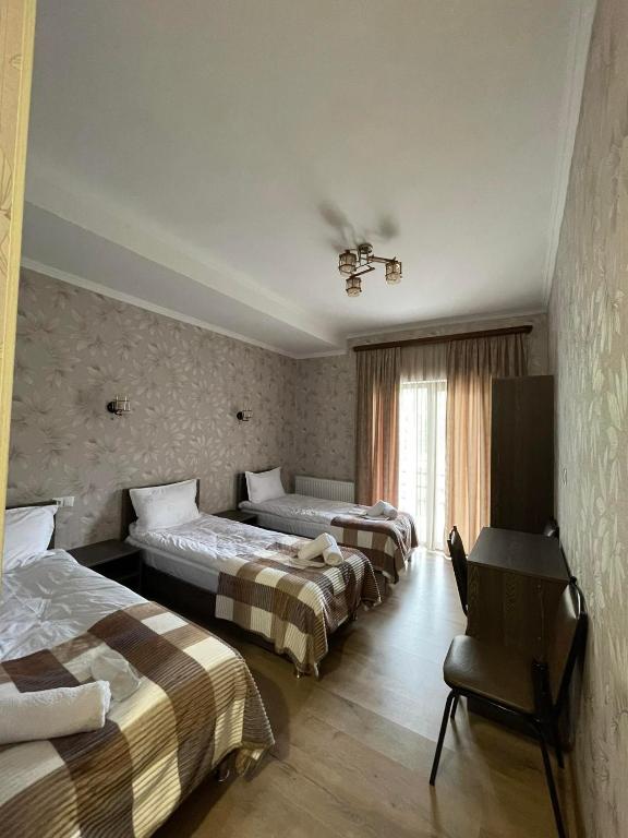 Postel nebo postele na pokoji v ubytování Hotel Shina