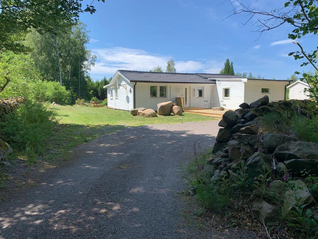 a house with two animals sitting in front of it at Großzuegiges Haus im Wald in Immeln