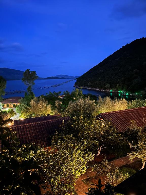 a view of a body of water at night at The Mussel House in Ksamil