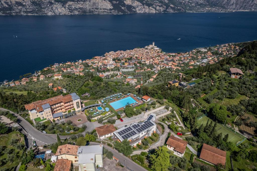 an aerial view of a city and the water at Natur Resort Panorama in Malcesine