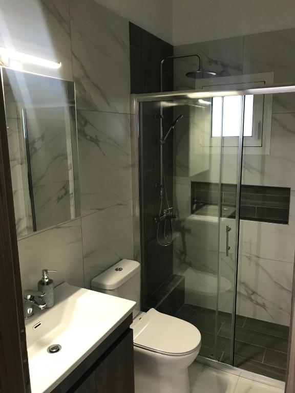 Koupelna v ubytování Bafas Apartments