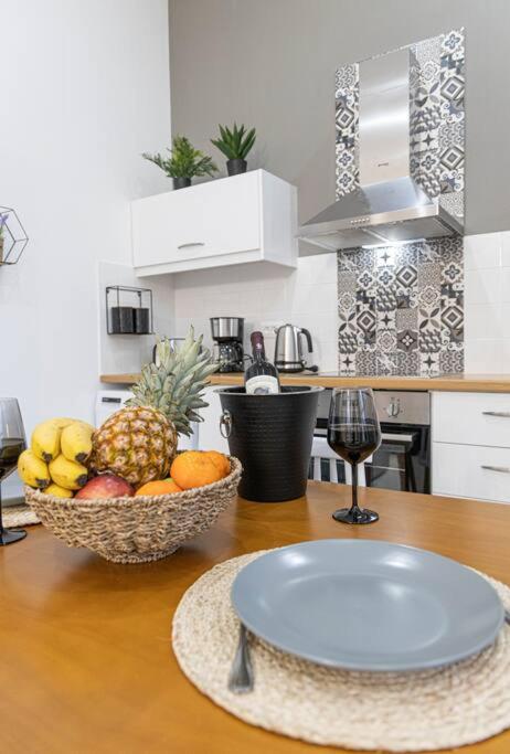 a kitchen with a bowl of fruit on a table at Nikolias dream house in Ialysos