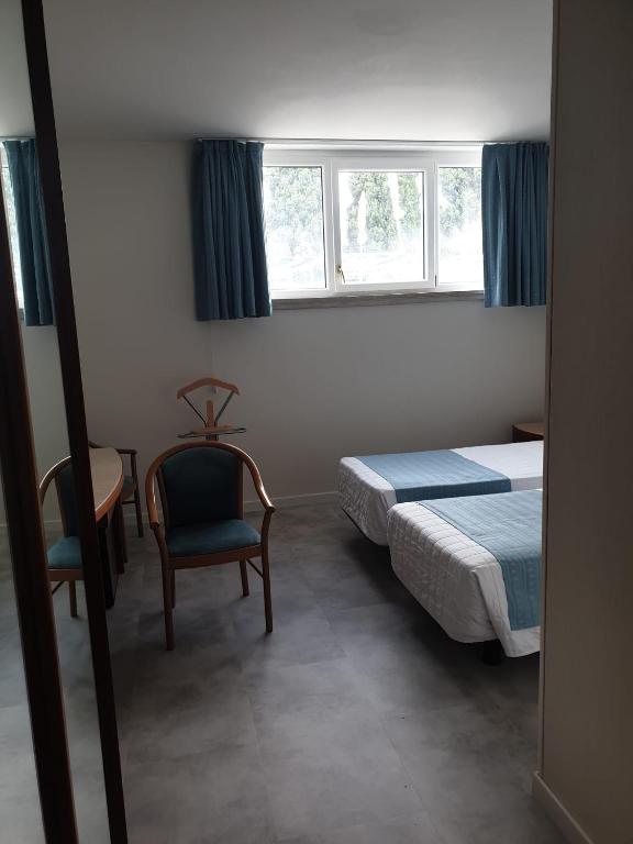 Postel nebo postele na pokoji v ubytování Hotel Excelsior Bay