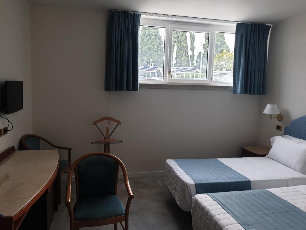 Postel nebo postele na pokoji v ubytování Hotel Excelsior Bay