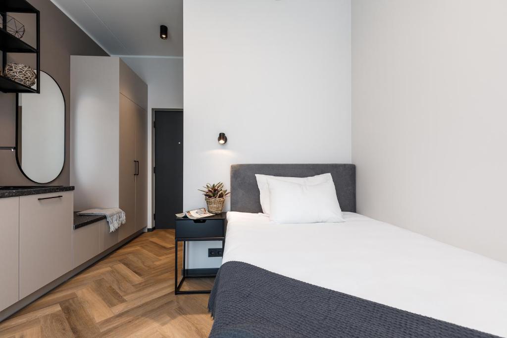 Postel nebo postele na pokoji v ubytování Rare Apartments - Self Check-In Miniapartments