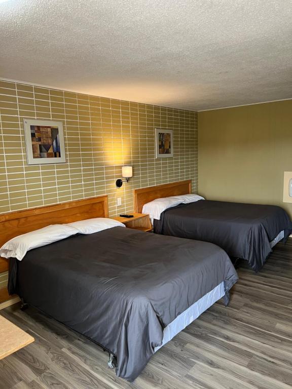 Postel nebo postele na pokoji v ubytování Motel 66