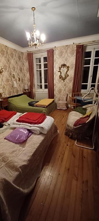 Postel nebo postele na pokoji v ubytování Chez Virginie
