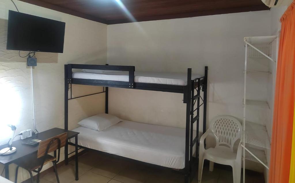 Postel nebo postele na pokoji v ubytování Hostel Pura Vida en Liberia