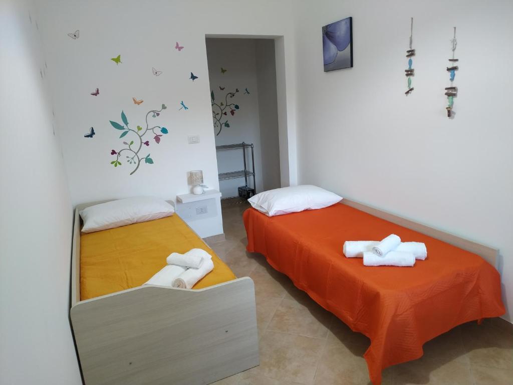 Postel nebo postele na pokoji v ubytování "Babbo" Nicola