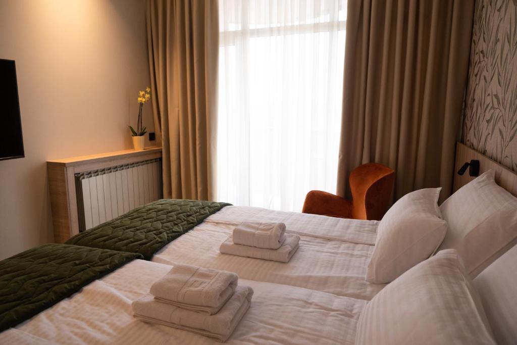 Postel nebo postele na pokoji v ubytování HOTEL GRACIAN