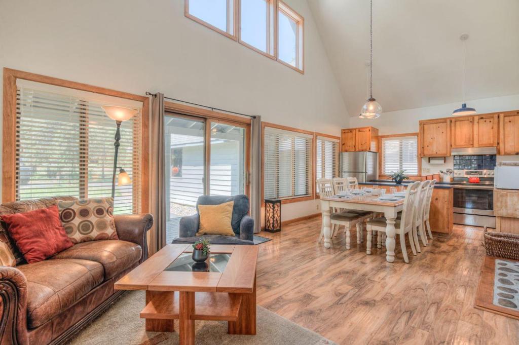 a living room with a couch and a table at Modoc - Unit 16 in Sunriver