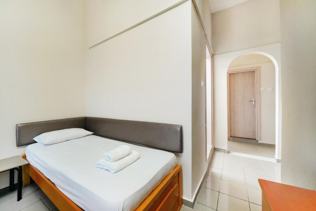 Postel nebo postele na pokoji v ubytování Hotel Papageorgiou