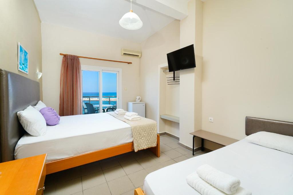 Postel nebo postele na pokoji v ubytování Hotel Papageorgiou