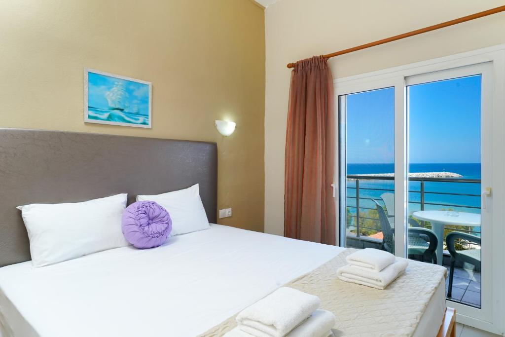 Postel nebo postele na pokoji v ubytování Hotel Papageorgiou
