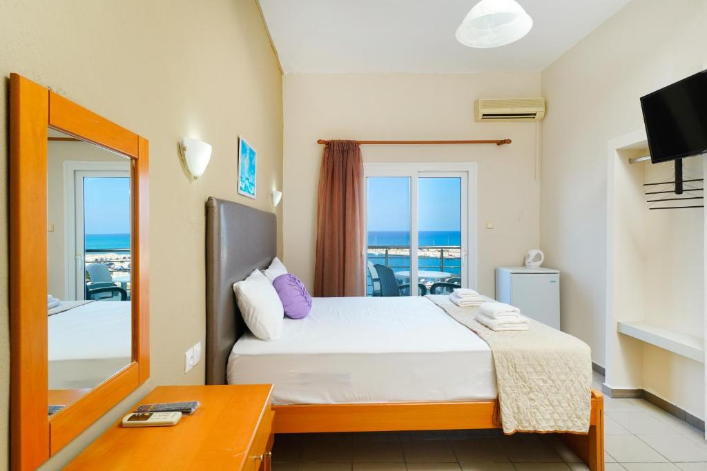 Postel nebo postele na pokoji v ubytování Hotel Papageorgiou