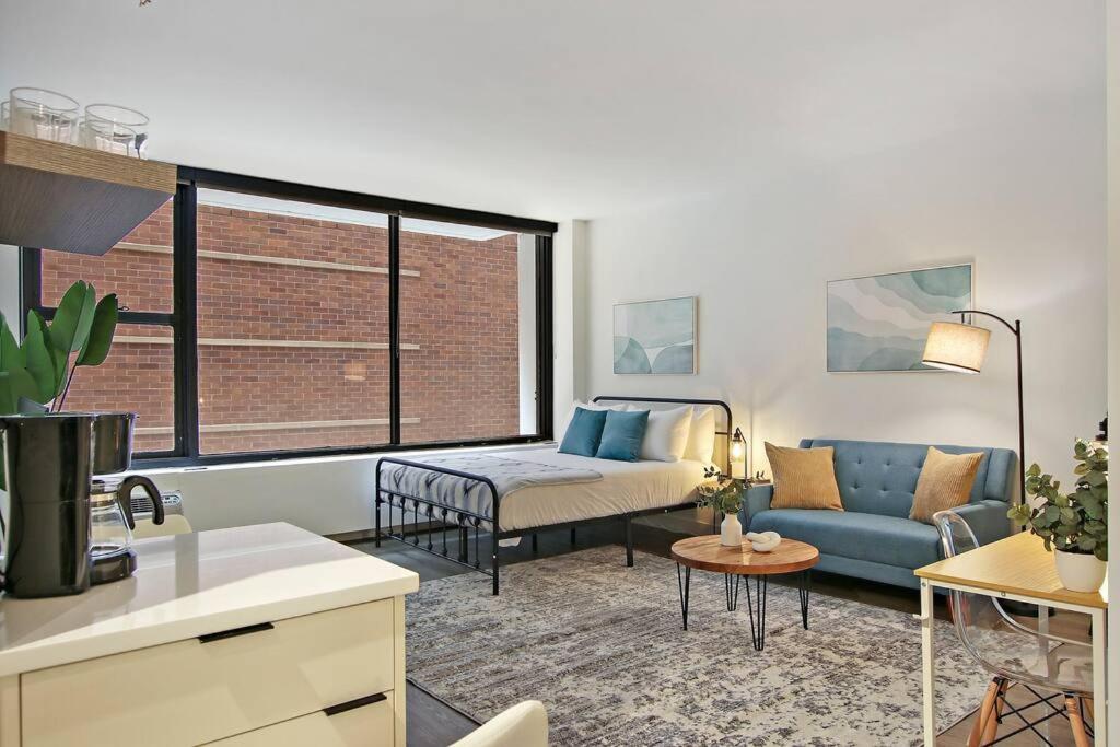 a small living room with a couch at Inviting Fully Furnished Studio Perfect Location- Chestnut 02D in Chicago