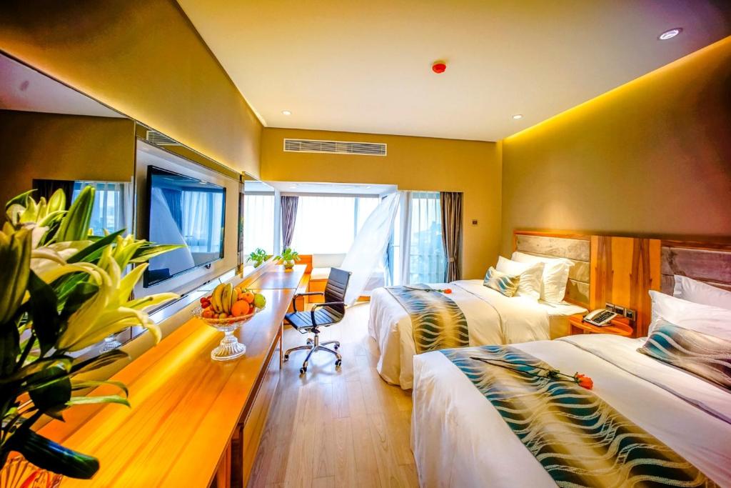 Postel nebo postele na pokoji v ubytování Sentosa Hotel Apartment Taoyuan Branch