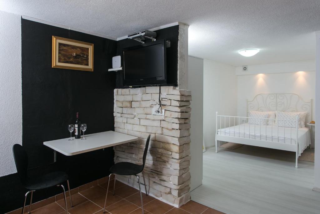 Postel nebo postele na pokoji v ubytování Apartments Heart of Dubrovnik