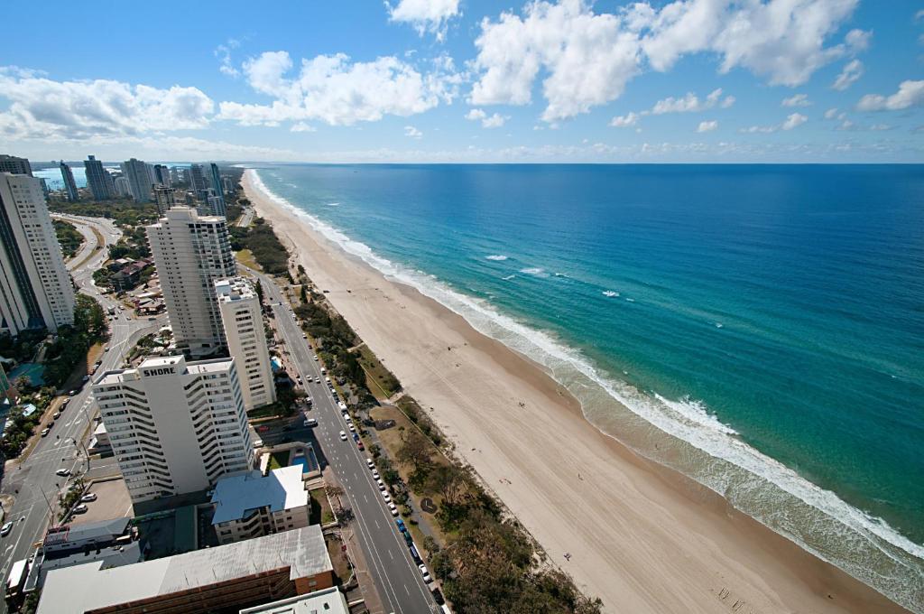 an aerial view of a beach and the ocean at Focus Apartments in Gold Coast