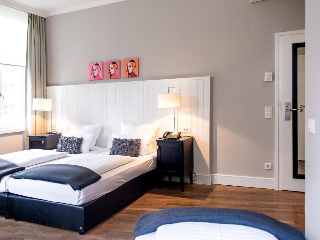 Cama ou camas em um quarto em Hotel Victoria