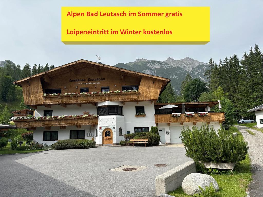 a large building with a wooden roof at W8 Haus Ganghofer in Leutasch