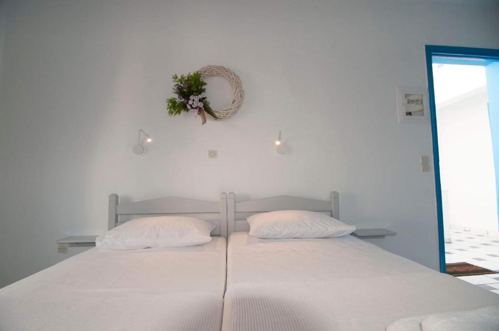 Postel nebo postele na pokoji v ubytování GIAVASI SEASIDE FINIKI