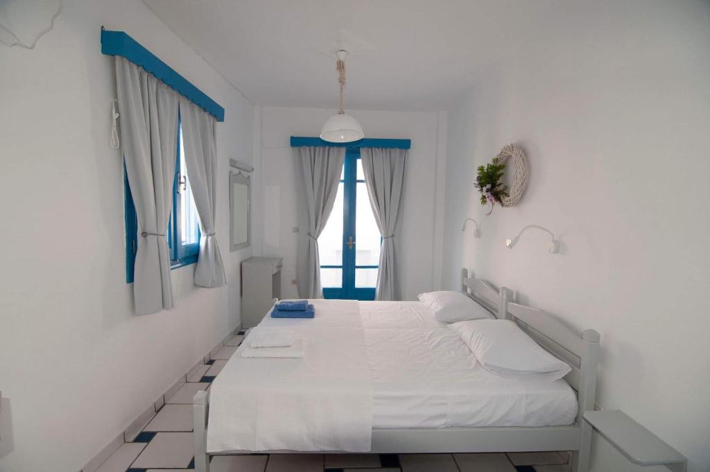 Postel nebo postele na pokoji v ubytování GIAVASI SEASIDE FINIKI