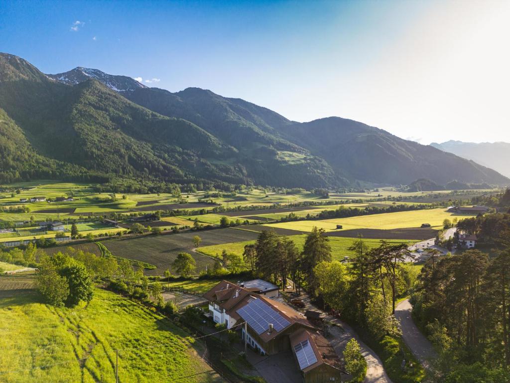 an aerial view of a valley in the mountains at Posthof in Campo di Trens