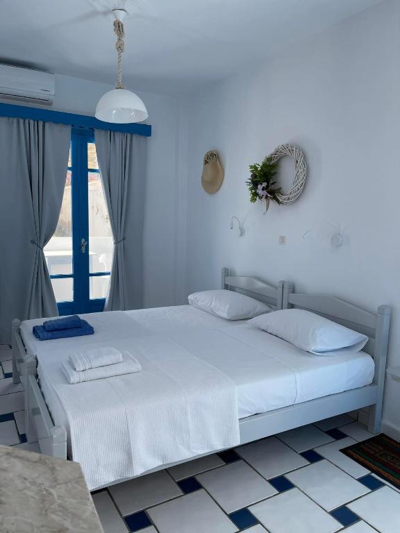 Postel nebo postele na pokoji v ubytování GIAVASI SEASIDE FINIKI
