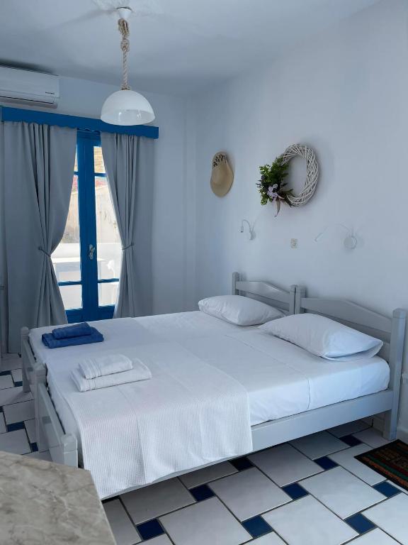 Postel nebo postele na pokoji v ubytování GIAVASI SEASIDE FINIKI