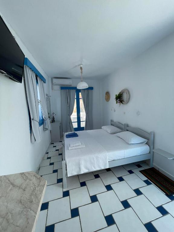 Postel nebo postele na pokoji v ubytování GIAVASI SEASIDE FINIKI
