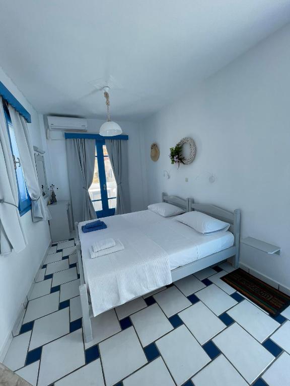 Postel nebo postele na pokoji v ubytování GIAVASI SEASIDE FINIKI