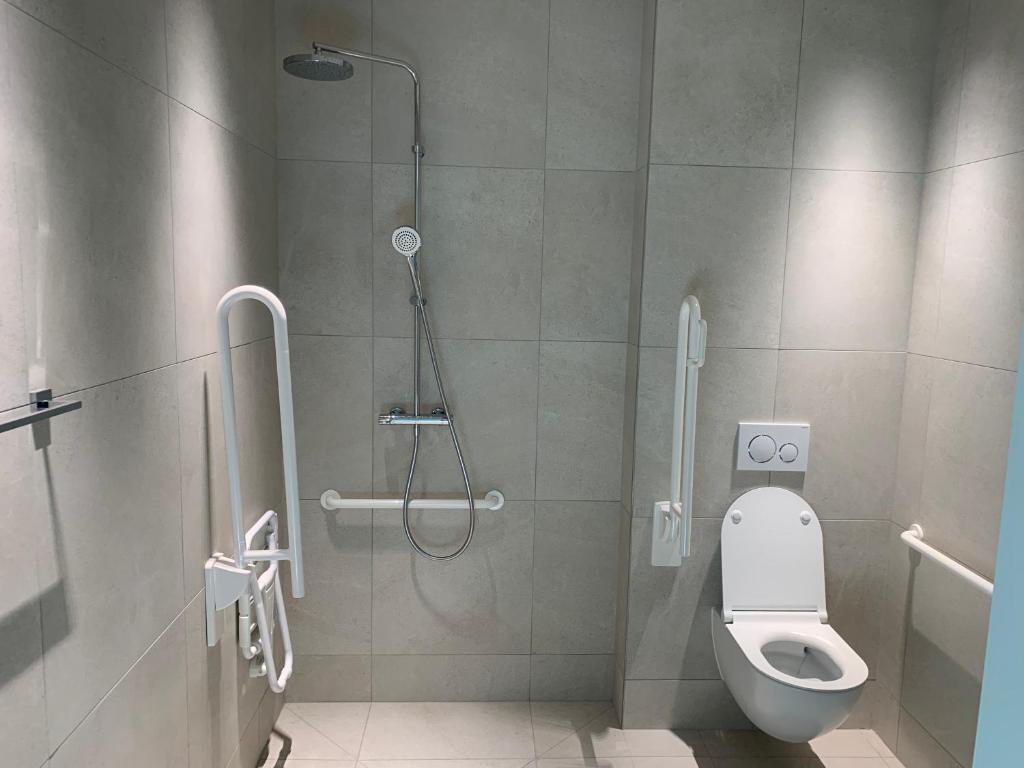 Koupelna v ubytování OPO Hotel