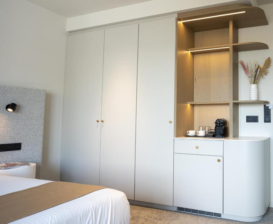 Postel nebo postele na pokoji v ubytování OPO Hotel