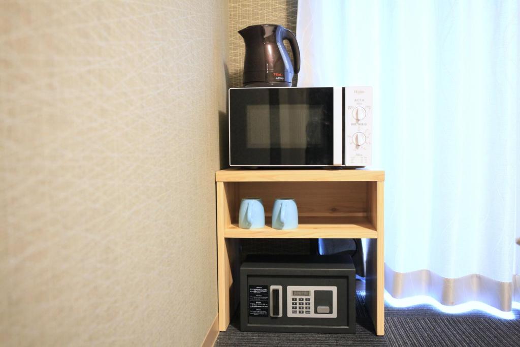 Kuchyň nebo kuchyňský kout v ubytování HOTEL LEGASTA KYOTO SHIRAKAWA SANJO