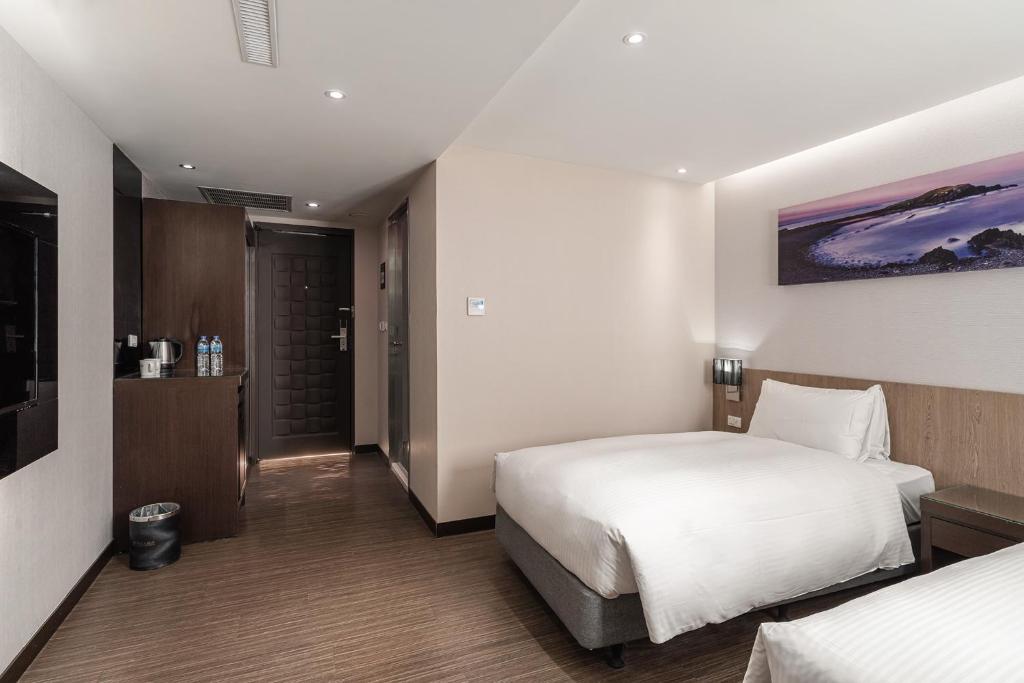 Postel nebo postele na pokoji v ubytování Hotel Yoshi