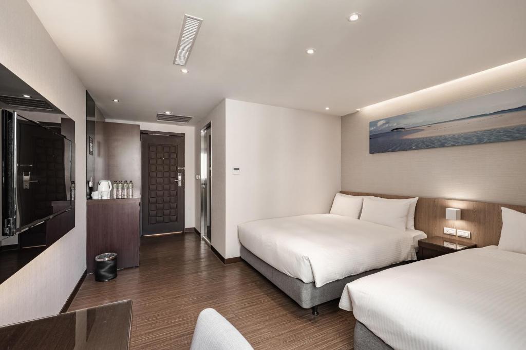 Postel nebo postele na pokoji v ubytování Hotel Yoshi