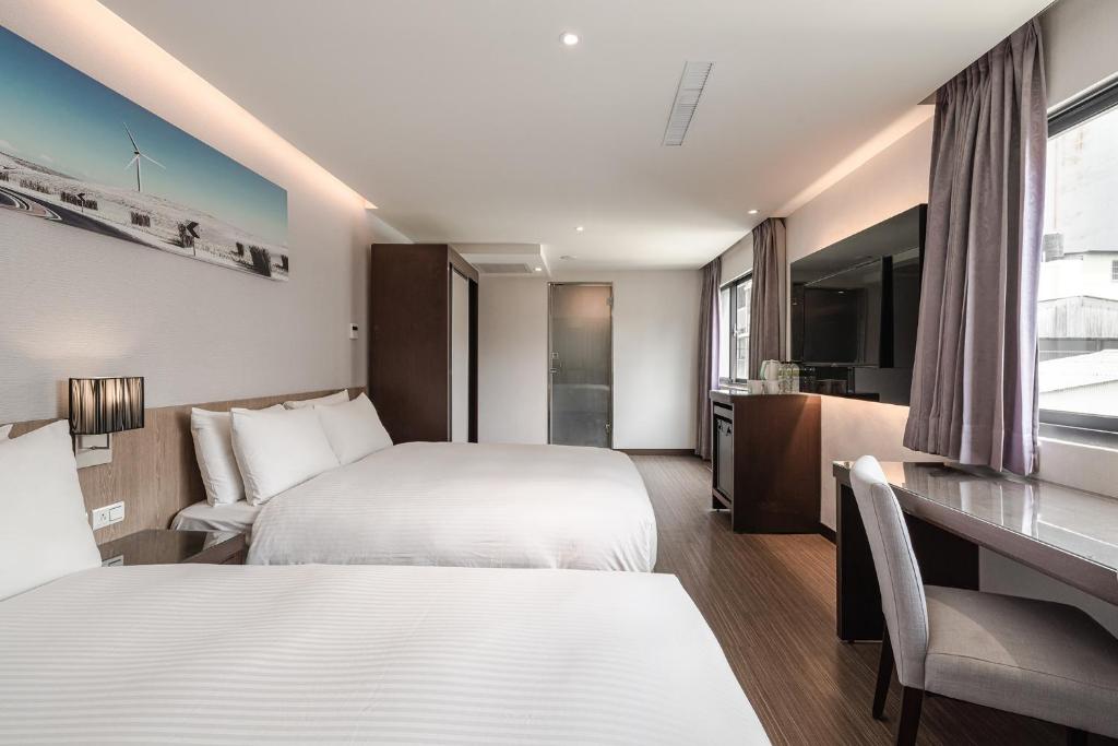 Postel nebo postele na pokoji v ubytování Hotel Yoshi