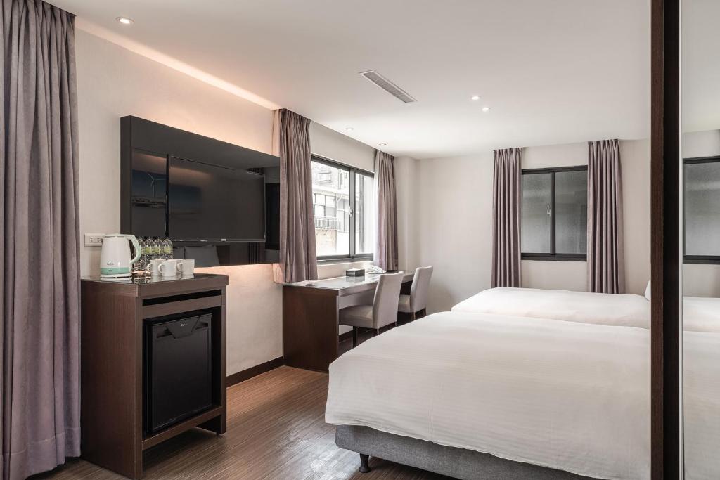 Postel nebo postele na pokoji v ubytování Hotel Yoshi