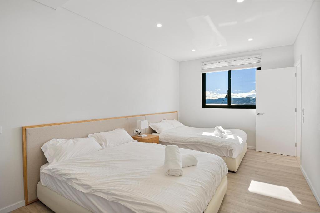 Postel nebo postele na pokoji v ubytování Lake View Suites Jindabyne
