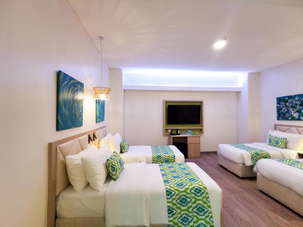 Postel nebo postele na pokoji v ubytování Lime Resort El Nido