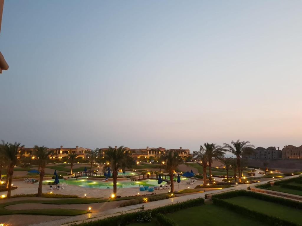 a view of a park at night with palm trees at LA vista 6 topaz in Ain Sokhna