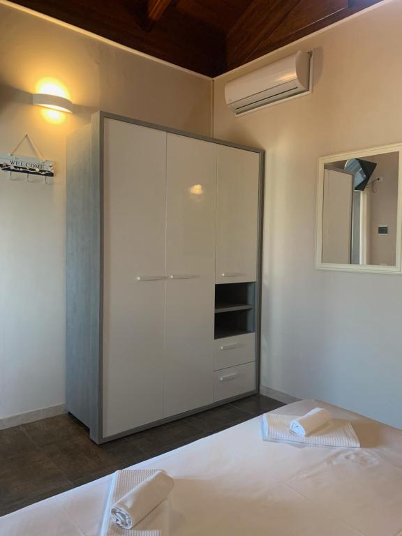 Posteľ alebo postele v izbe v ubytovaní Spiaggia Le Dune Residence