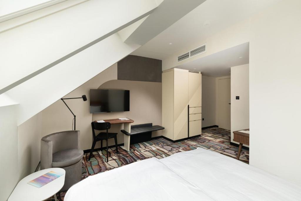 Voodi või voodid majutusasutuse Hotel GIN Budapest toas