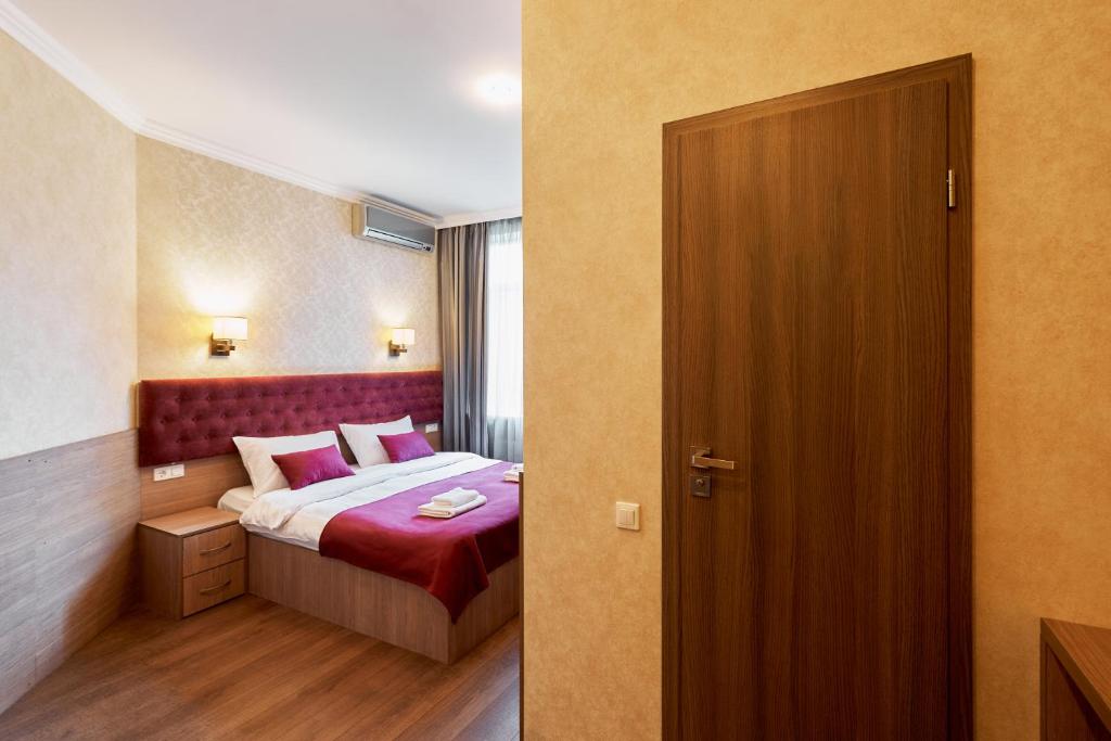 Postel nebo postele na pokoji v ubytování Hotel Classic