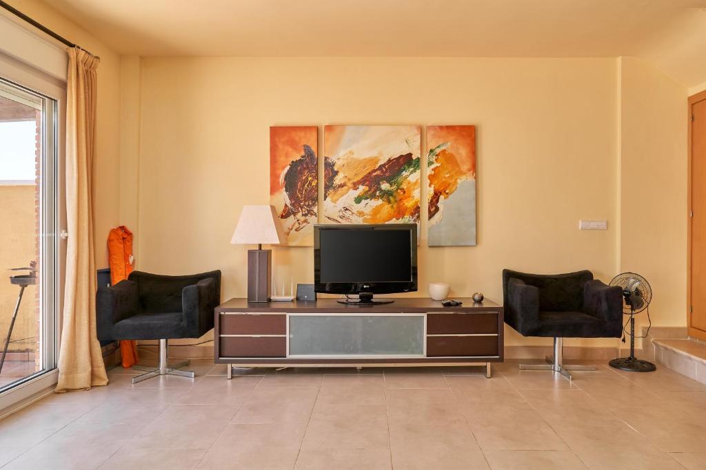 TV a/nebo společenská místnost v ubytování Casa Fuentes 2 B2