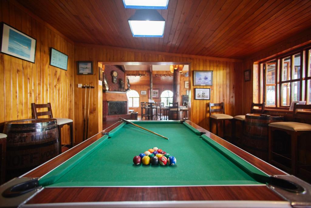 a pool table with balls on it in a room at Aero Club of East Africa in Nairobi