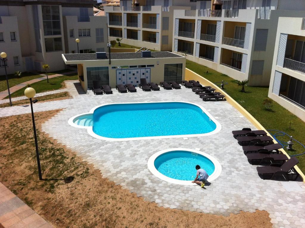 an overhead view of a swimming pool in a building at Paraiso Dourado in Porto Santo