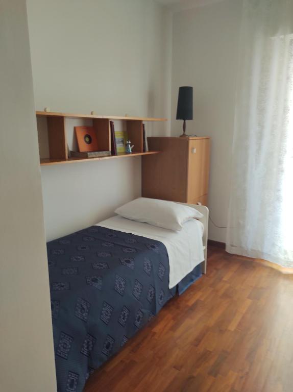 Postel nebo postele na pokoji v ubytování Sette cuscini affittacamere